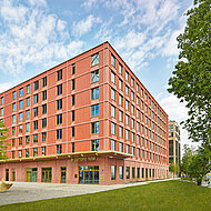 GIMA: Neue Fassade greift den Charme des ehemaligen Pfanni-Fabrikgeländes auf