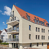 Schlagmann: Gebäude mit Knick - Stadtbild prägender Wohnhausneubau im historischen Kontext